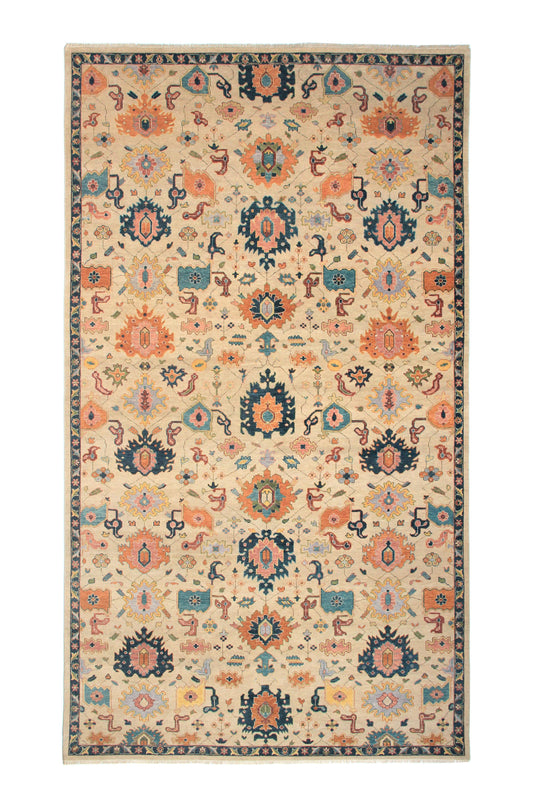 Custom hand-knotted wool rug, 10x17, Mahal design, Cassim Rug Gallery. A hand-knotted wool rug with an intricate geometric pattern in beige, blue, and red hues.