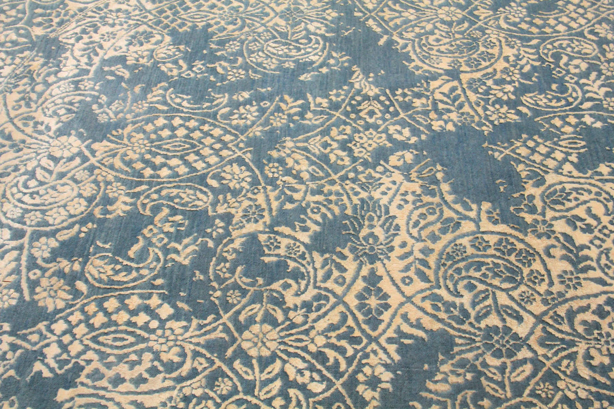 Paisley blue and beige round hand-knotted rug — close-up of paisley motif