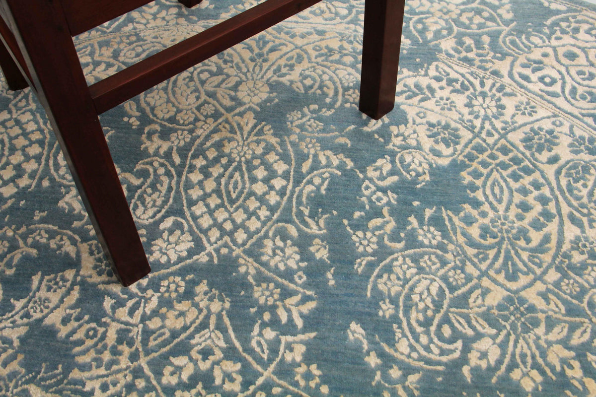 Paisley blue and beige round hand-knotted rug — close-up of paisley motif