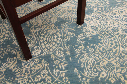 Paisley blue and beige round hand-knotted rug — close-up of paisley motif